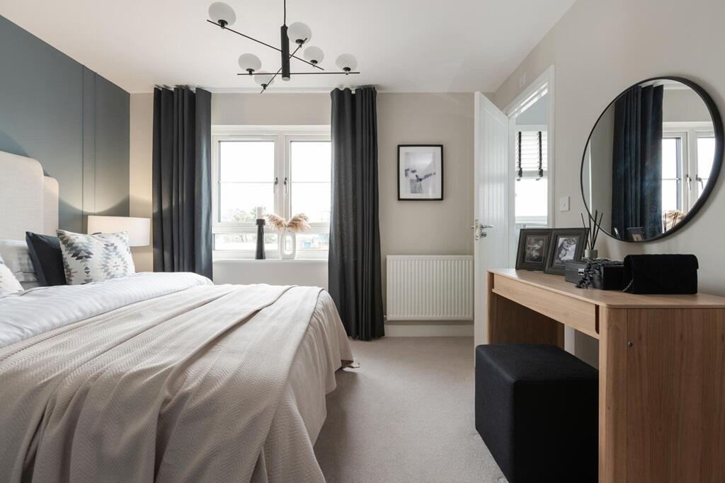 The king-size main bedroom has ample storage space