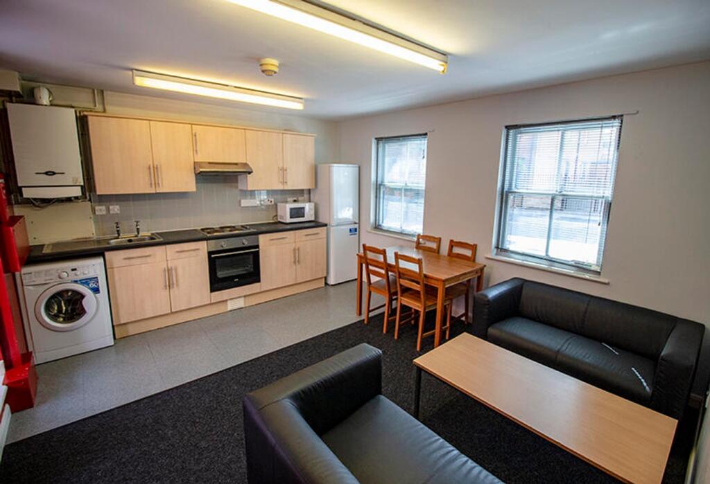 This inviting kitchen area features modern appl...