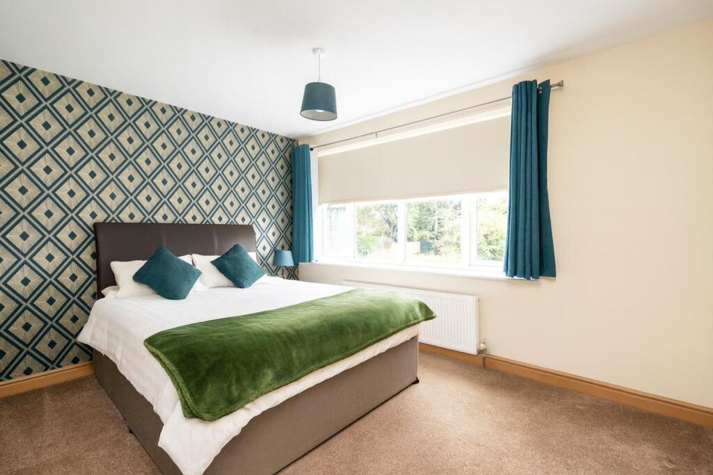 Serene Teal-Toned Bedroom Retreat.jpg