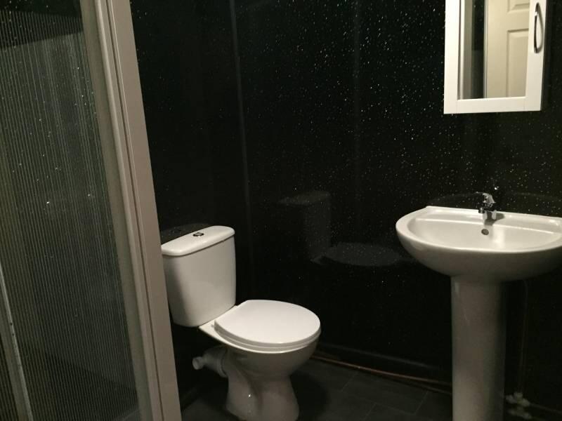 A clean and functional bathroom featuring a toi...