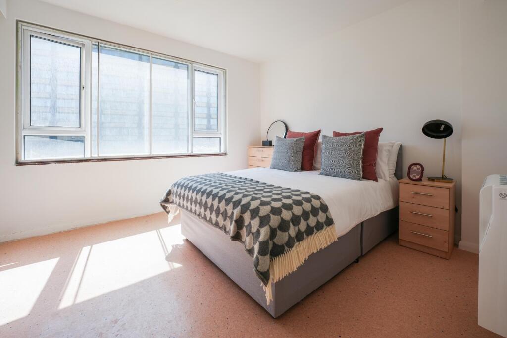 Bright and inviting double bedroom featuring a ...