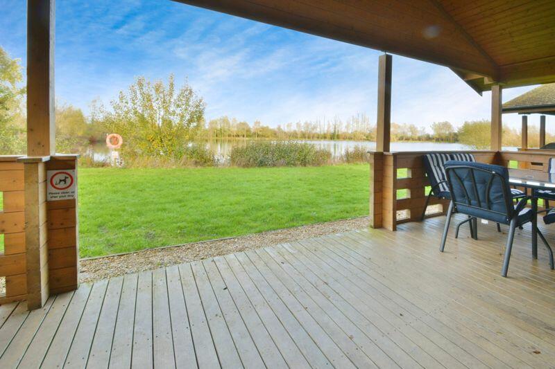 Terrace leading to gardens and lake