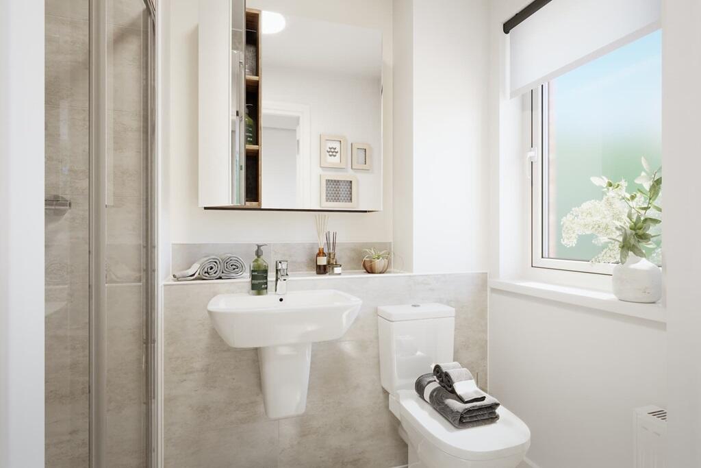 Bed 1 boasts an en suite shower room