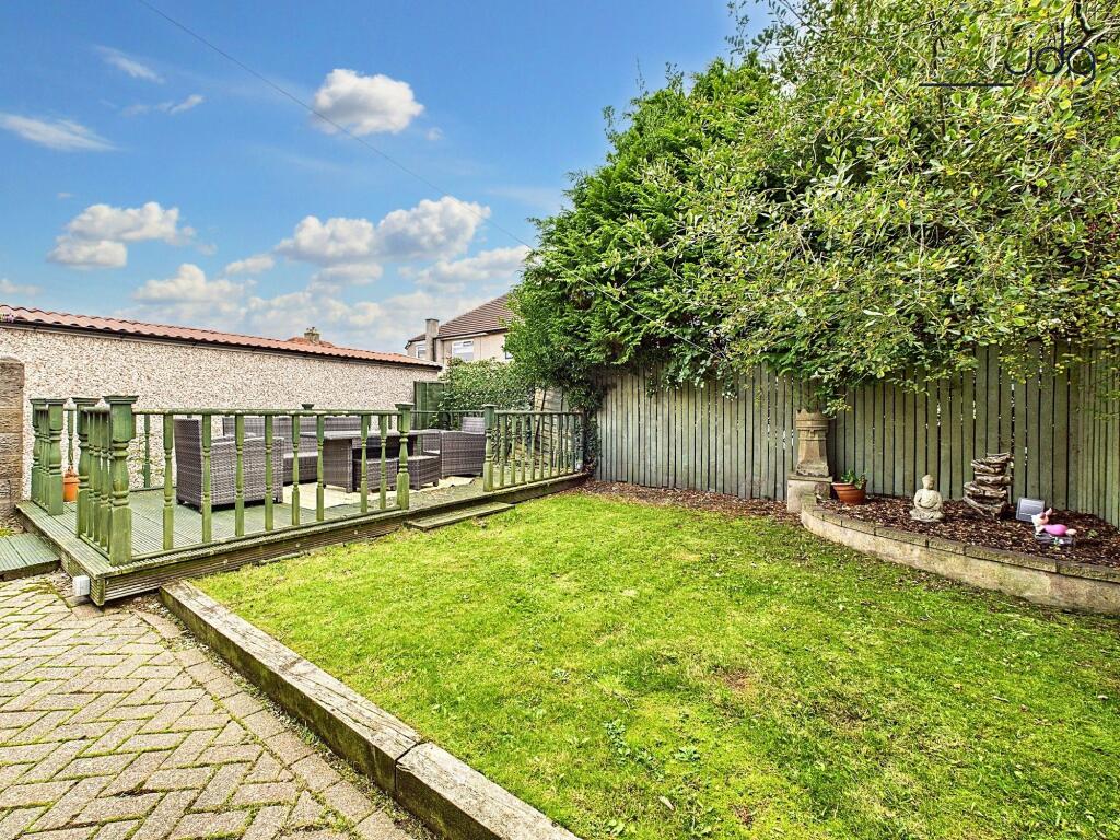 Spacious Garden with a mixture of lawn, decking and brick
