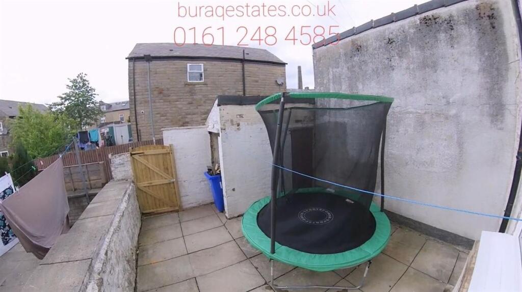 A tidy and private outdoor garden space with pa...