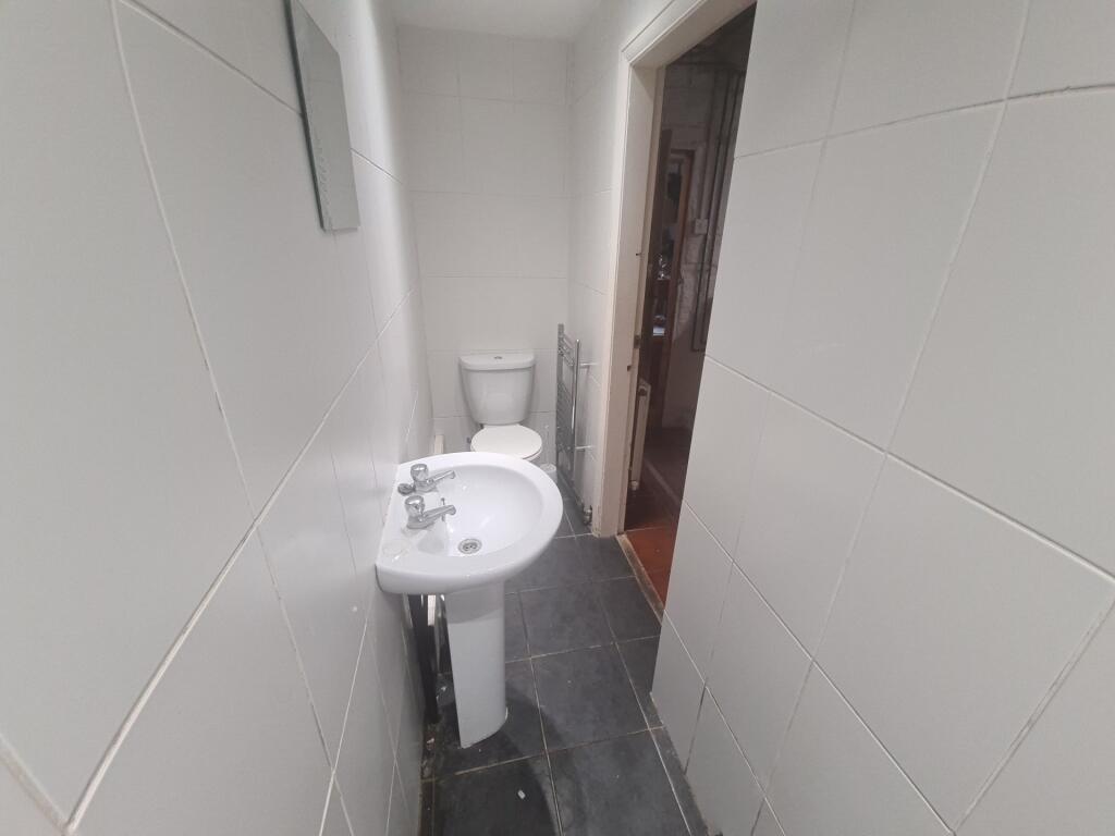 A clean and functional bathroom with a toilet a...