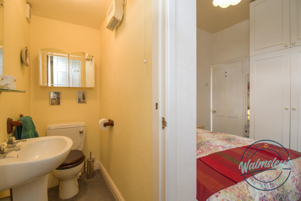 Cloakroom and rear double bedroom