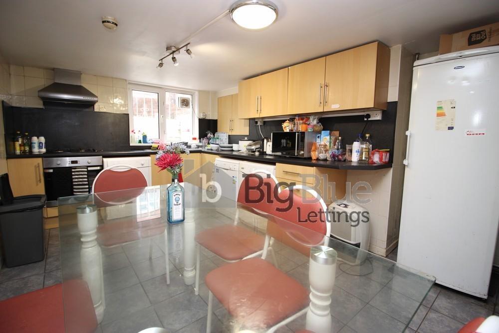 Bright and spacious kitchen featuring ample cab...
