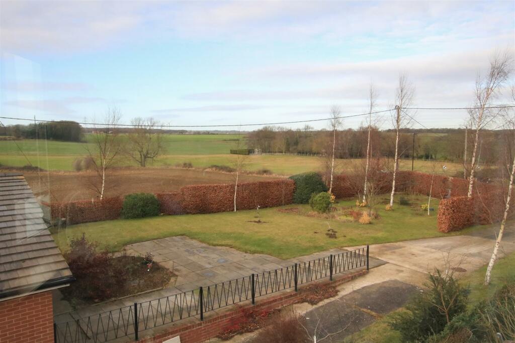 OUTLOOK OVER COUNTRYSIDE