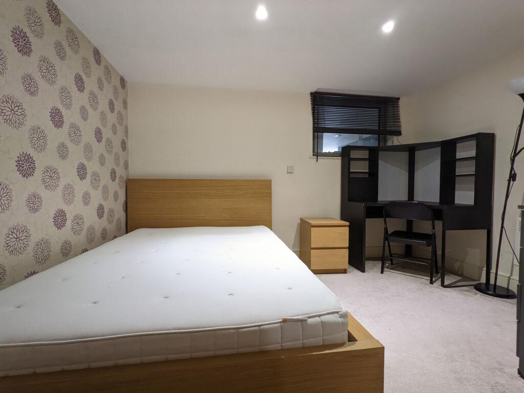 Bright, neatly presented bedroom with a modern ...