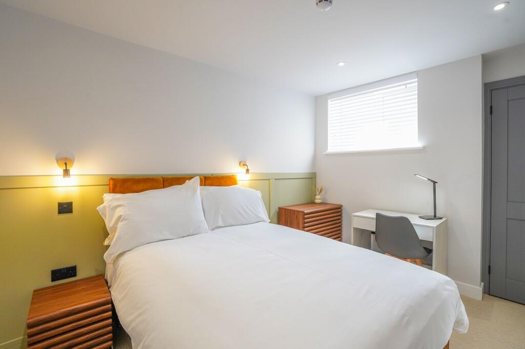 Bright and inviting master bedroom featuring a ...