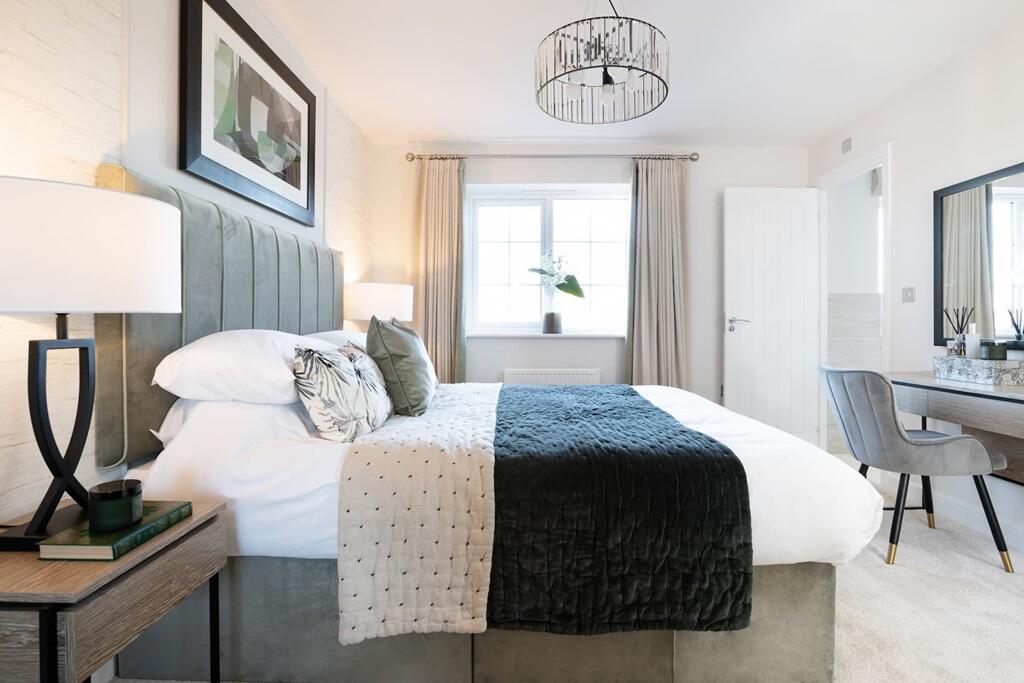 A bright main bedroom to relax in at the end of a busy day