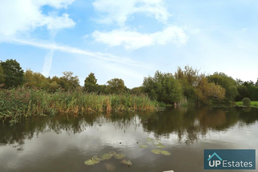 VIEW OF LAKE FROM GARDEN