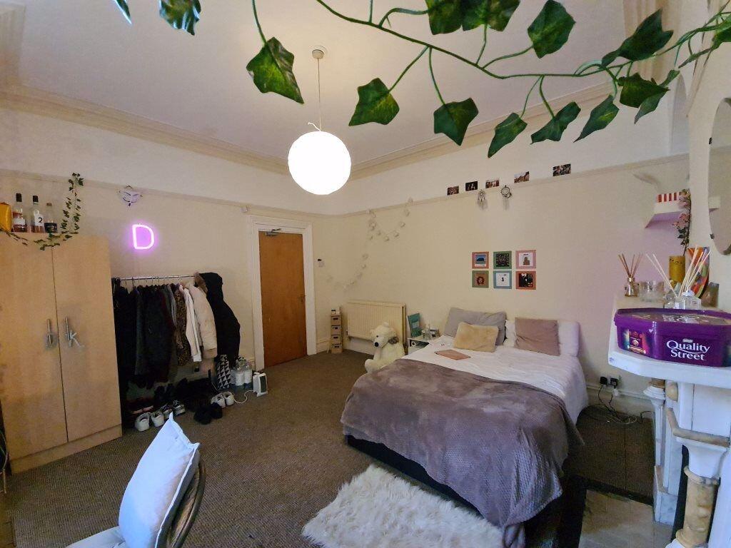 Bright and welcoming master bedroom featuring a...