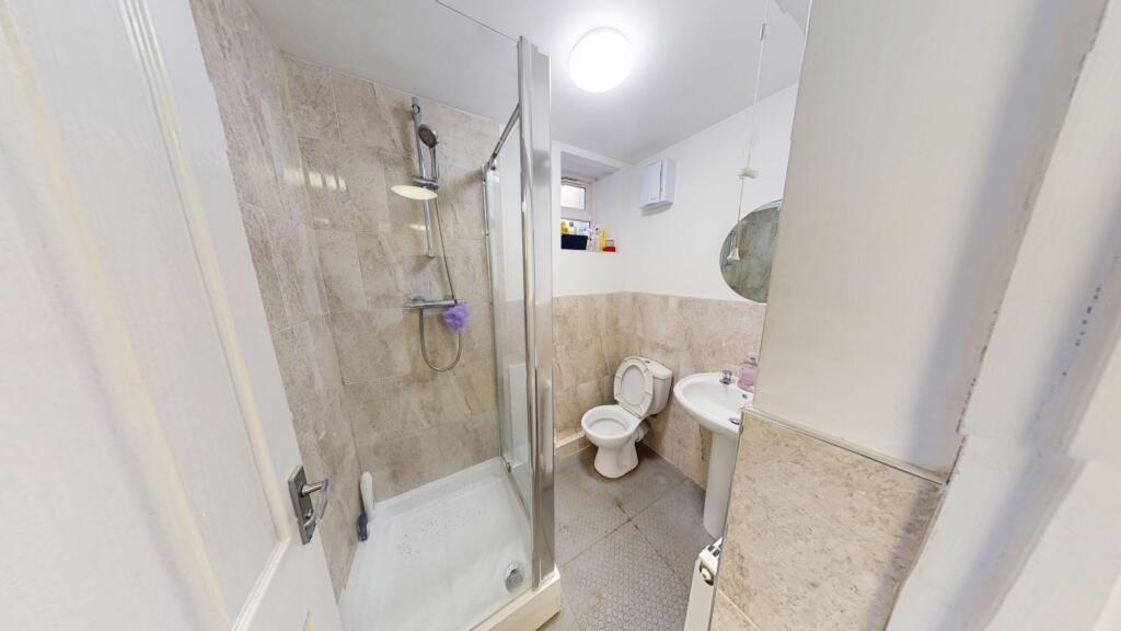 A well-maintained bathroom featuring a modern s...