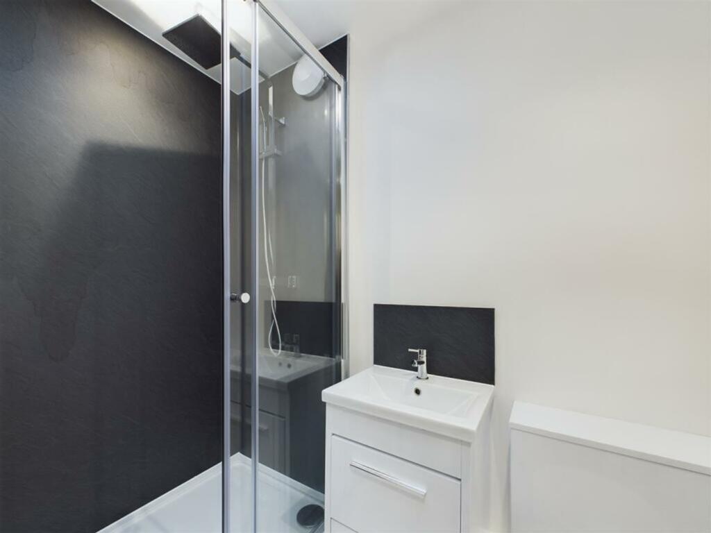 A modern and stylish bathroom featuring a sleek...