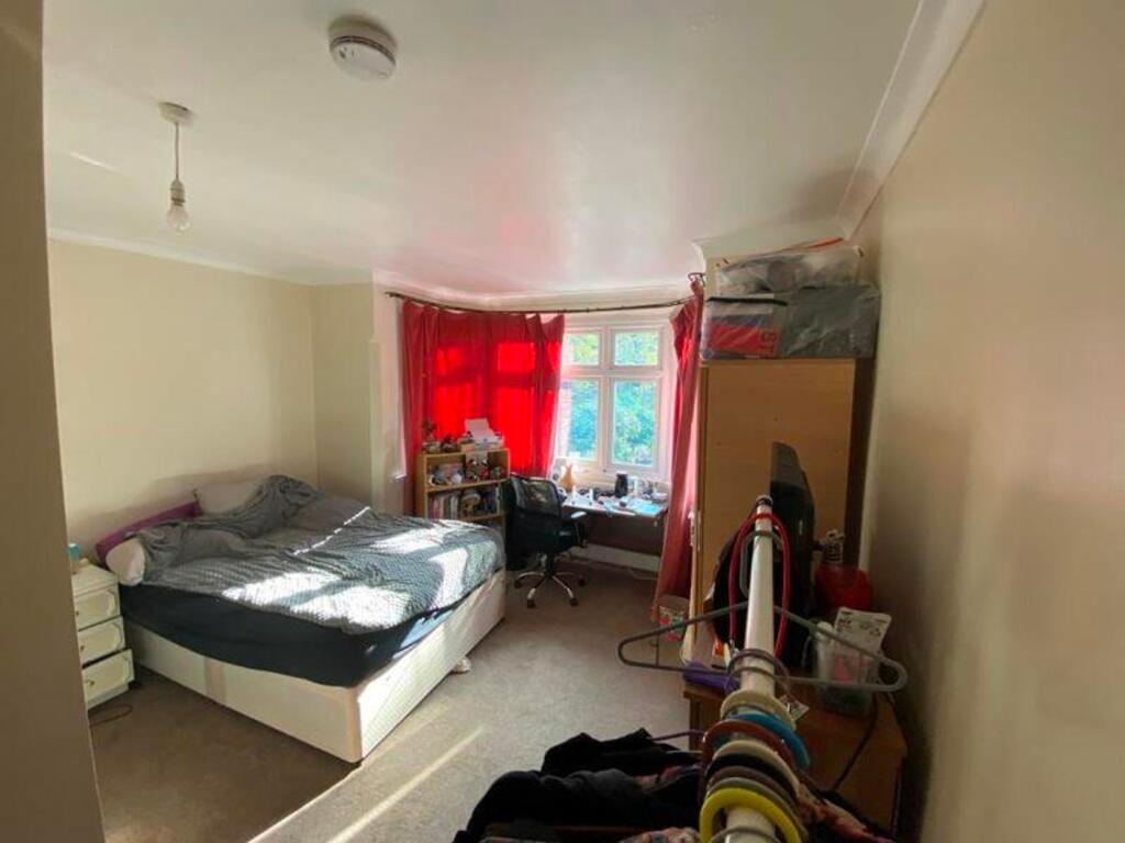 A bright and inviting double bedroom with ample...