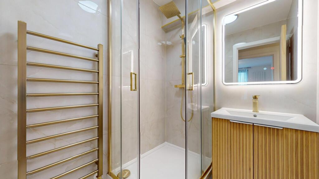 Bright and modern bathroom featuring a stylish ...