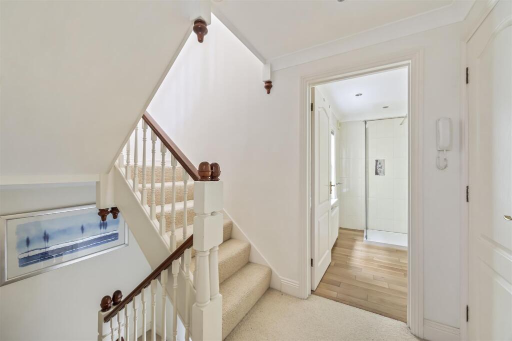 Stairs rising to Second Floor
