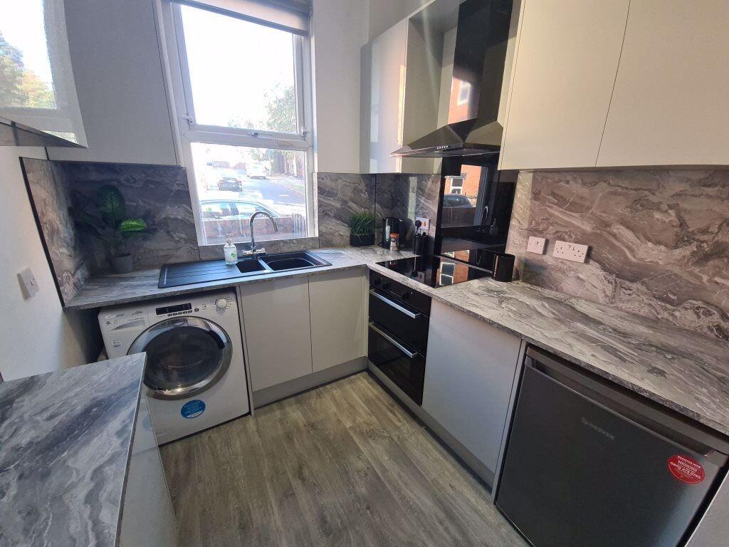 Modern kitchen with contemporary grey marble-ef...