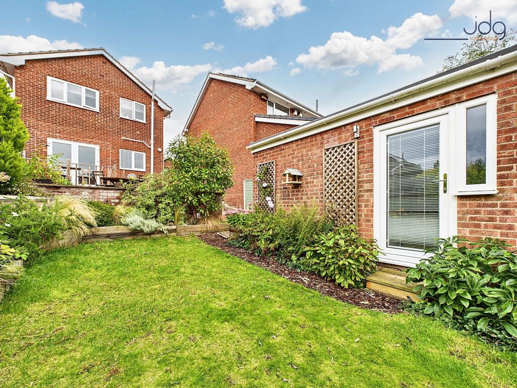 Tiered Garden with plenty of seating areas, flagged, decked and mixed lawn.