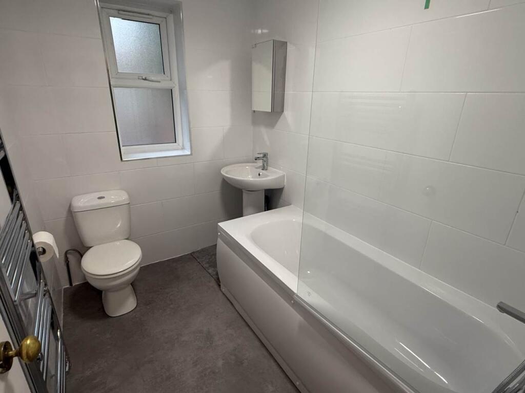 A modern, well-maintained bathroom featuring a ...