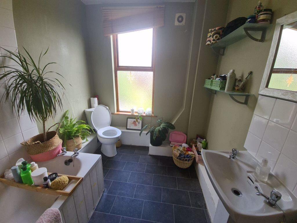 A bright and well-maintained bathroom featuring...
