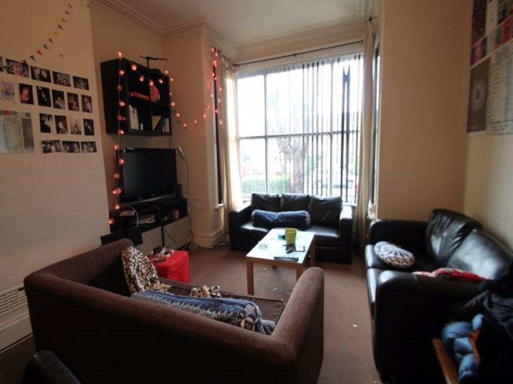 Bright and inviting living room featuring a lar...
