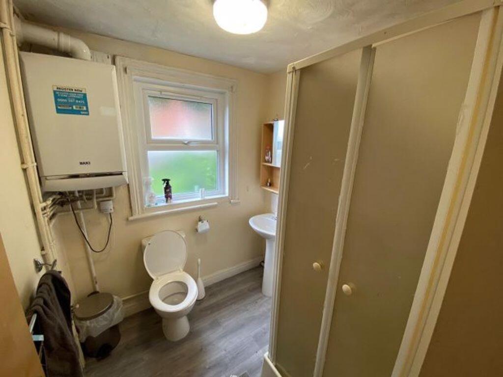 A compact and functional bathroom featuring a t...
