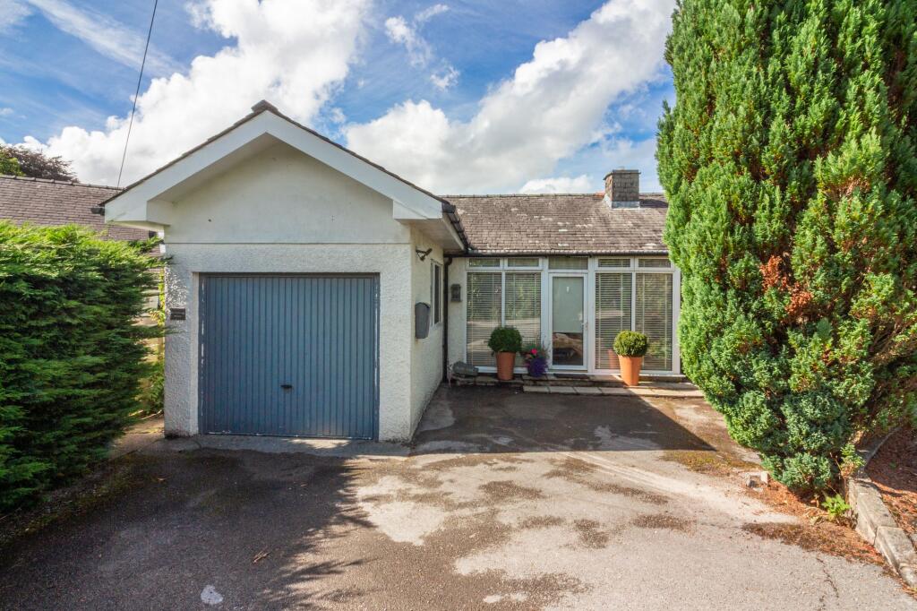Front elevation, driveway and garage