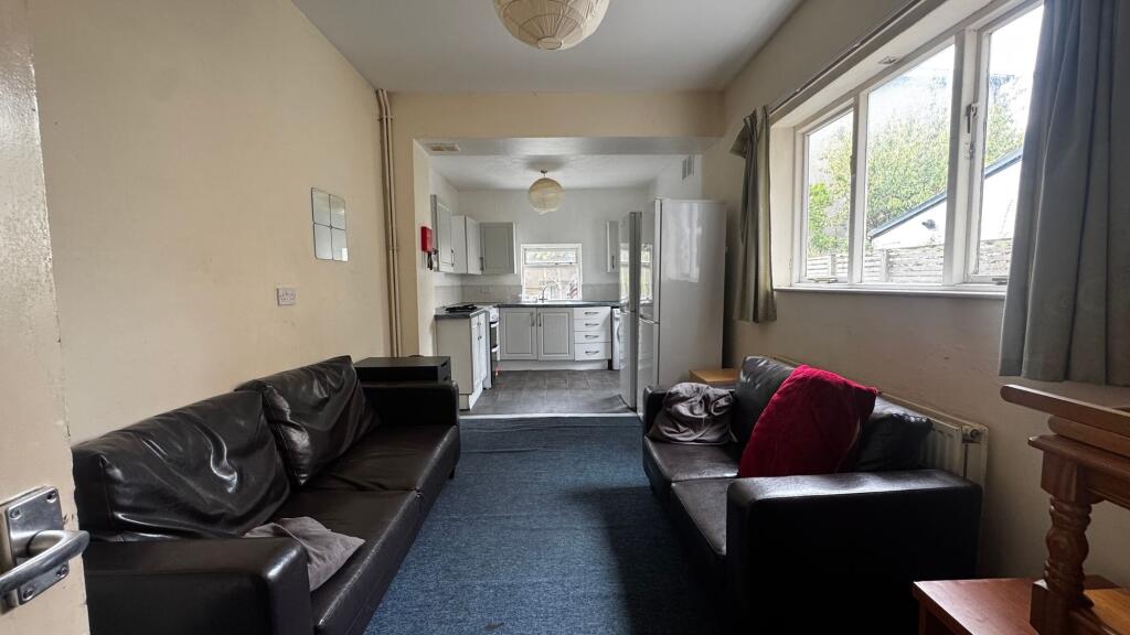 A cozy living room featuring two comfortable le...