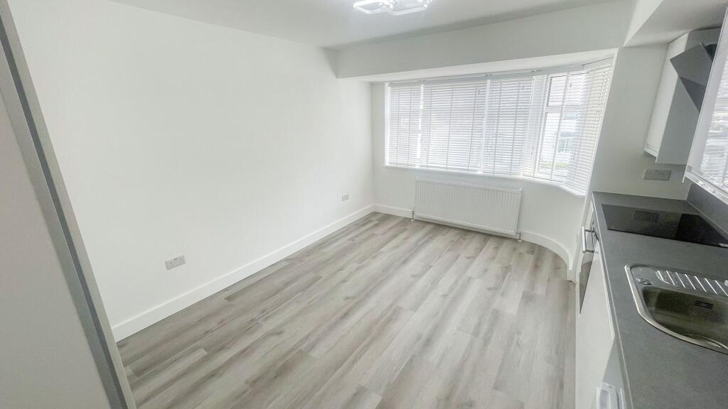 Bright and modern kitchen area with light wood ...