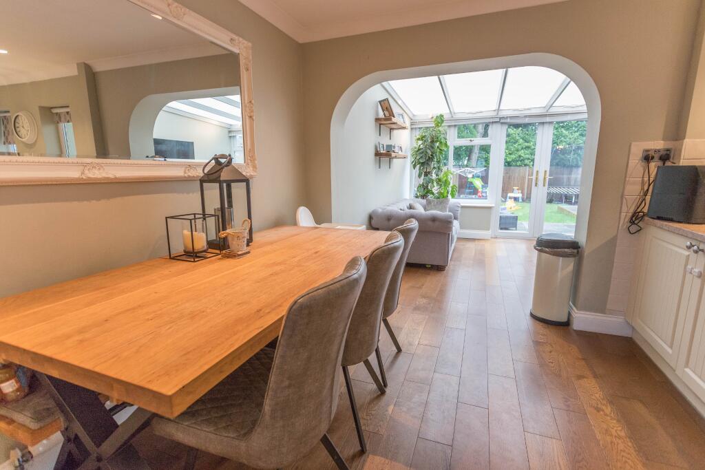 Dining Room Open to Conservatory