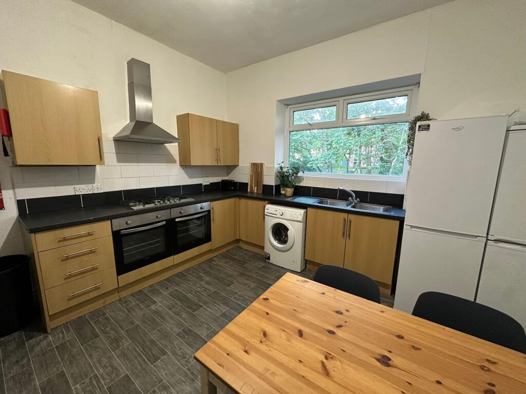 A bright and well-maintained kitchen with moder...