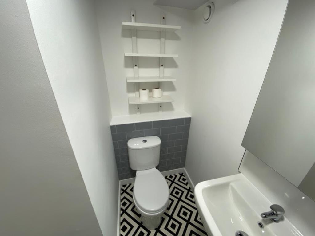 A stylish bathroom featuring modern fixtures an...