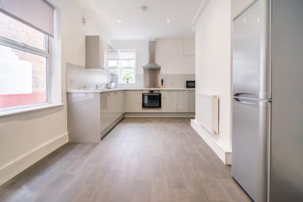 Modern kitchen featuring ample countertop space...