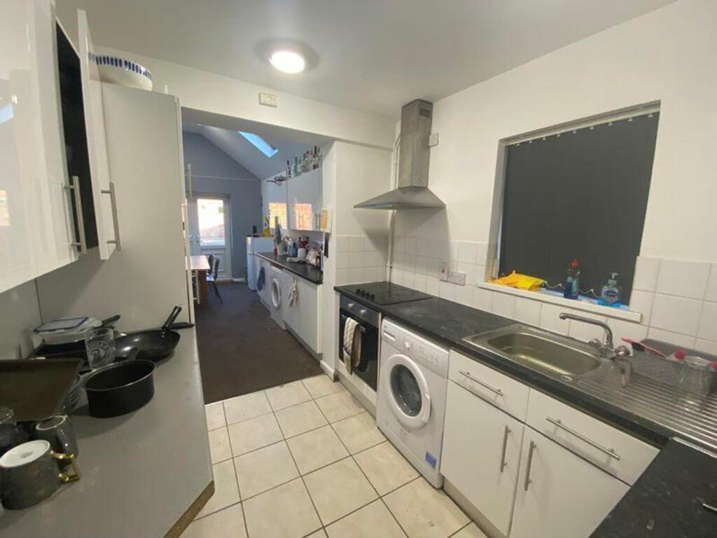 A spacious and bright kitchenette with modern a...