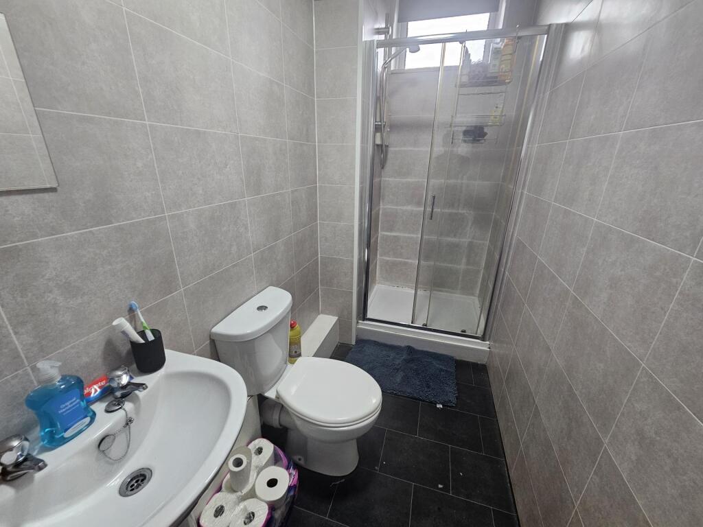 A clean and well-maintained bathroom featuring ...