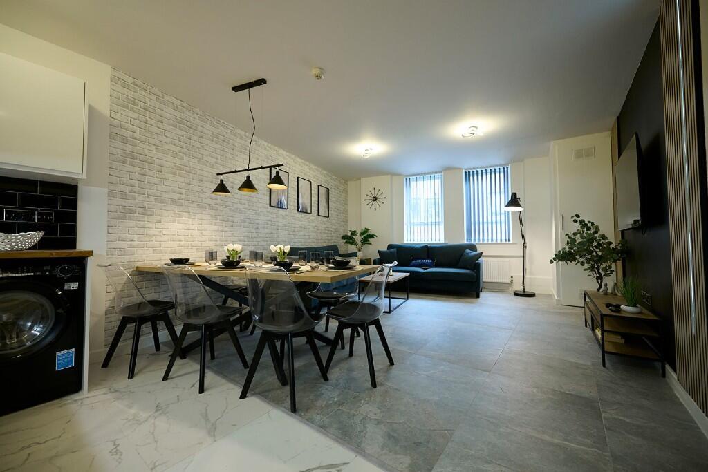 A modern and spacious living room featuring a l...