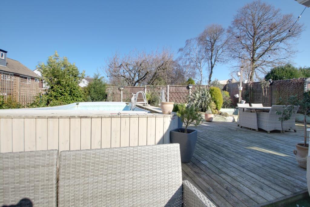 Part of the back garden showing the swimming pool