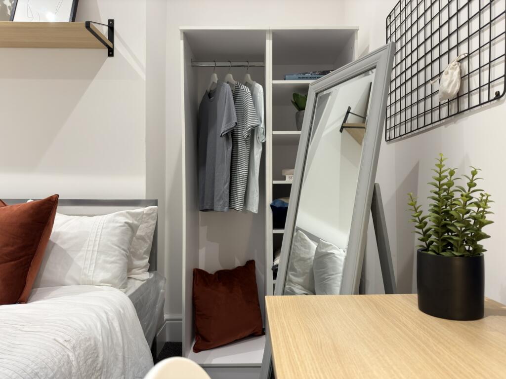 A stylish and inviting double bedroom with ampl...