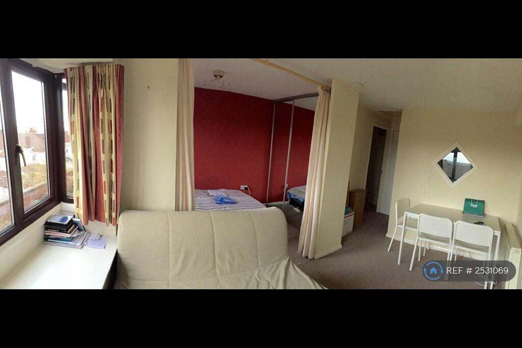 Lounge With Bedroom In Background Behind Curtains 