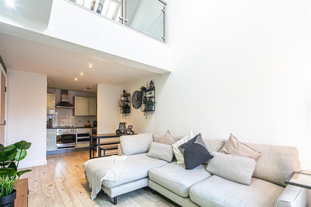 Sitting room through to kitchen