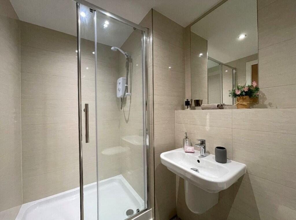A modern and well-maintained bathroom featuring...