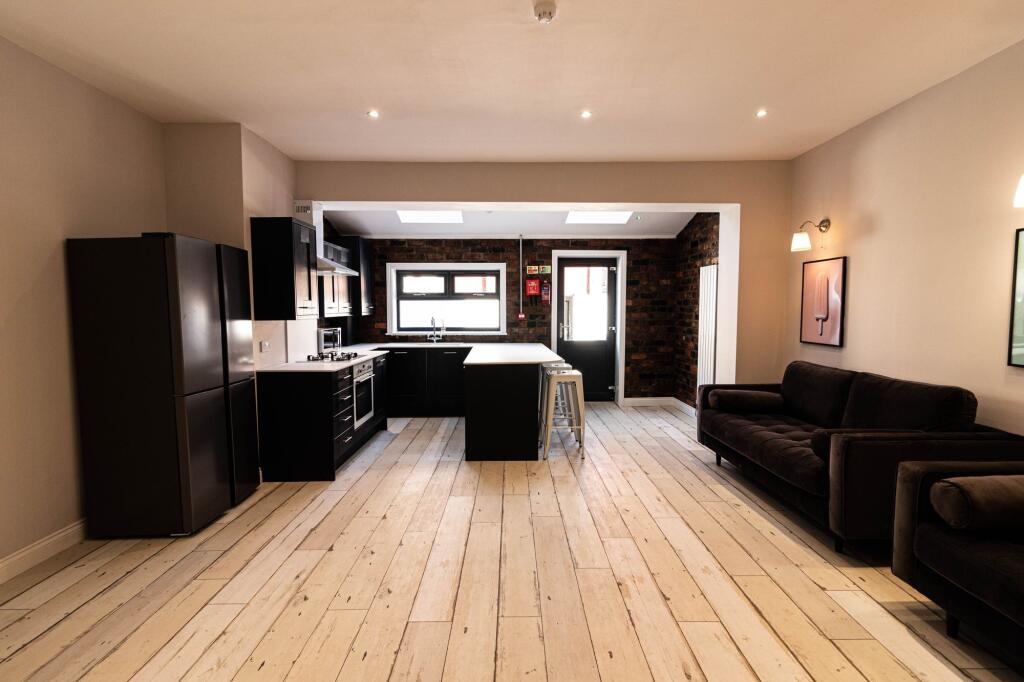 Contemporary open-plan living area with a fitte...