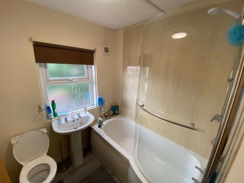 Bright and clean bathroom featuring a modern ba...