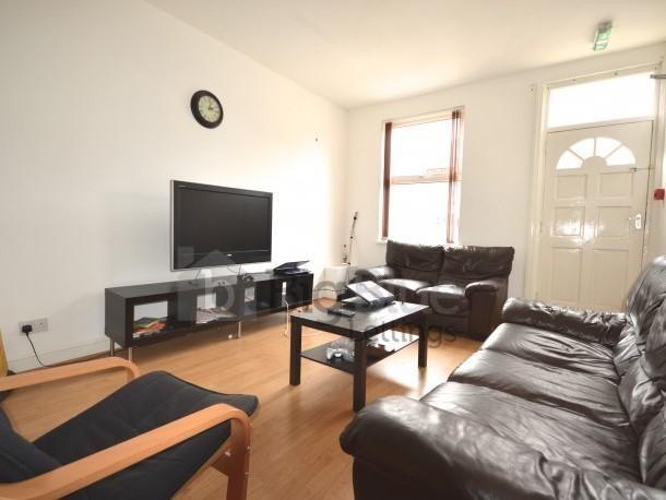 Bright and inviting living room featuring leath...
