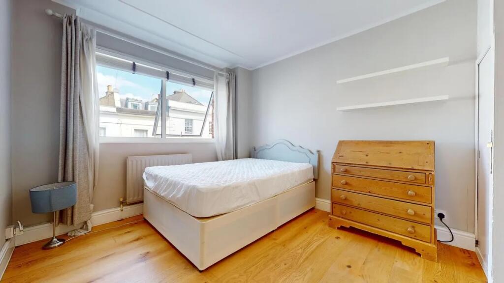 Bright and cozy double bedroom featuring a comf...