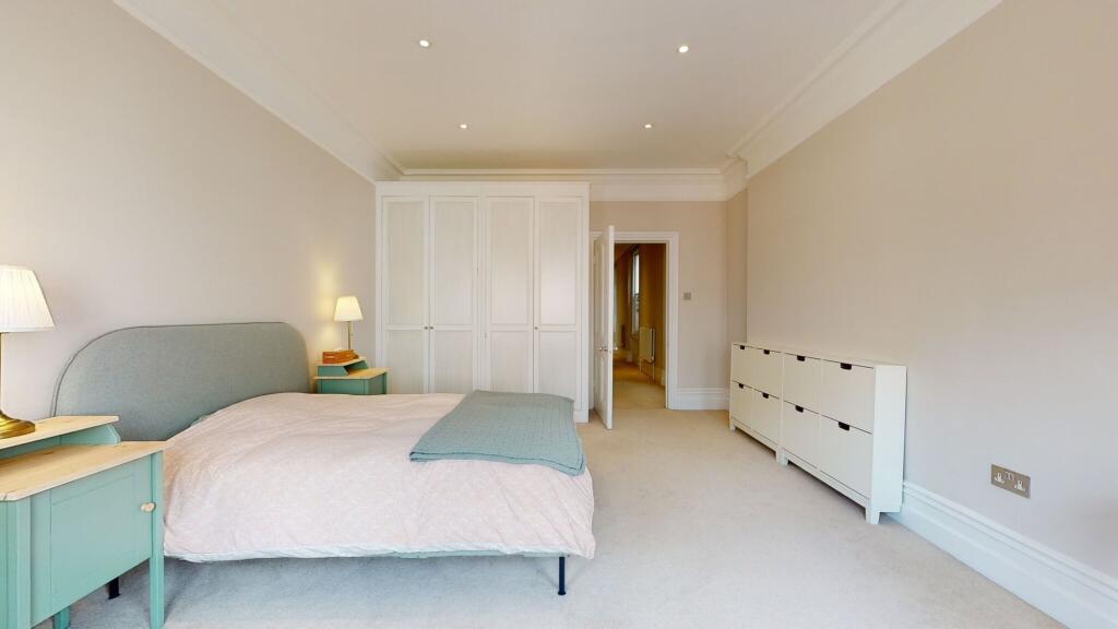 Spacious and serene master bedroom featuring a ...