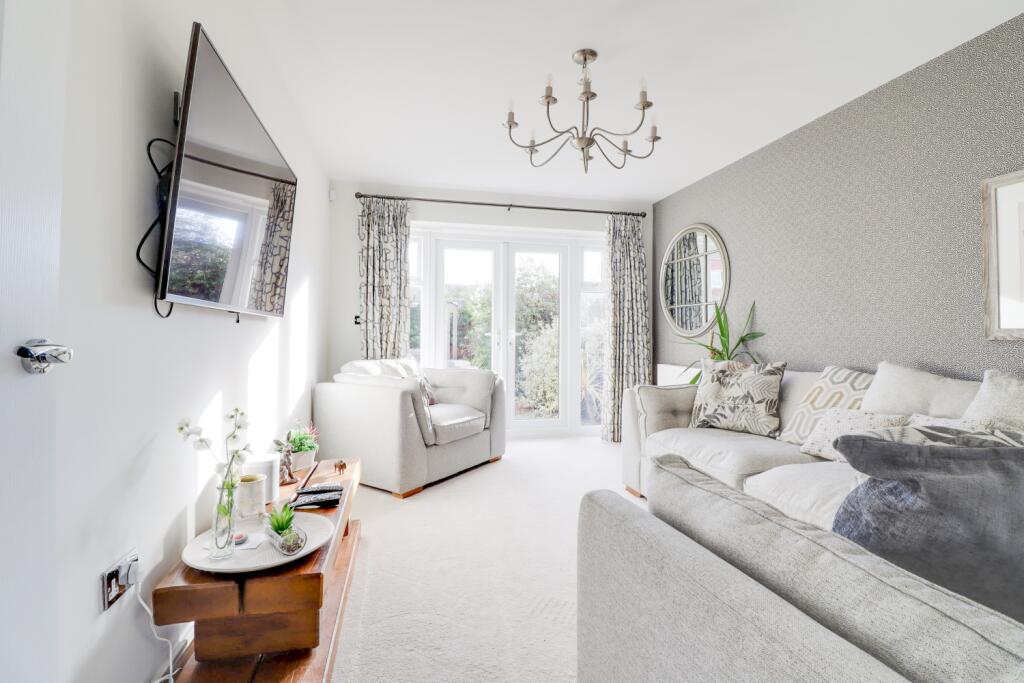 large reception room with garden access